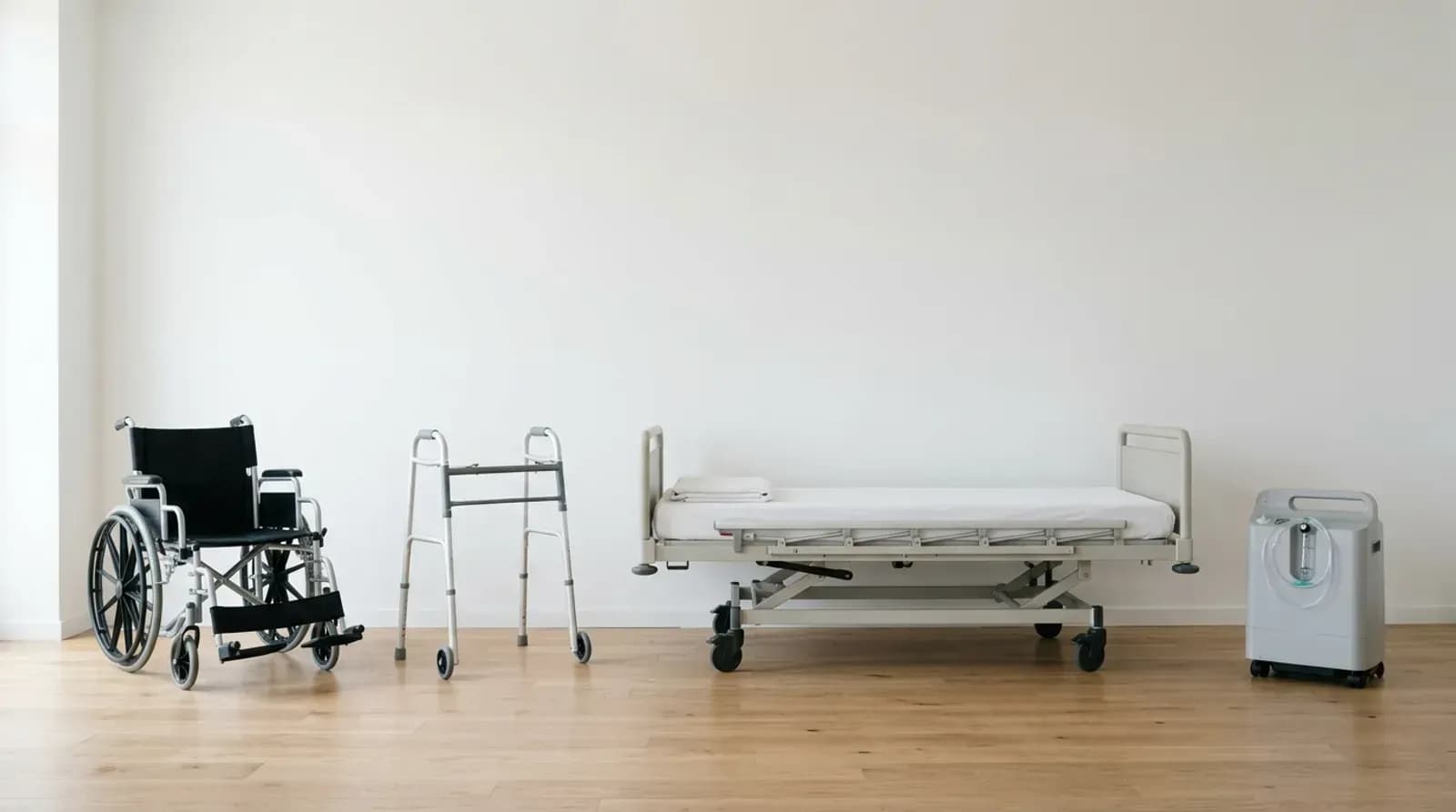 Medical equipment ready to rent: a wheelchair, a walker, a hospital bed and an oxygen concentrator